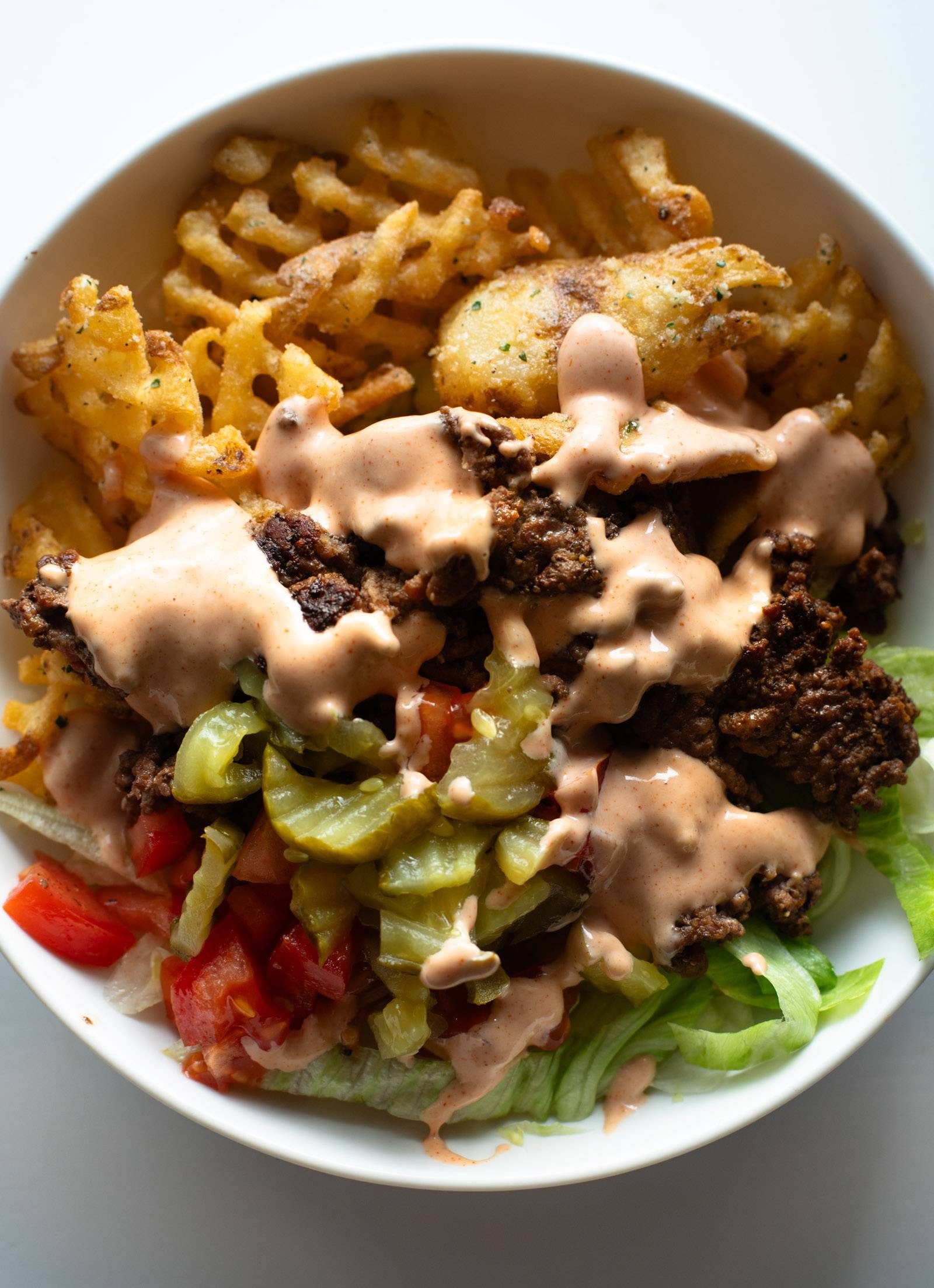Burger bowls with house sauce.